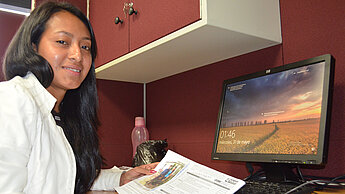 Elizabeth, 22, at her desk at Plan International Guatemala's Cou